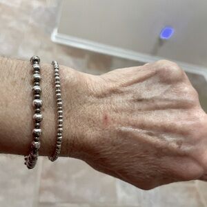 2-Sterling bracelets-one with uniform beads the other with small and large beads